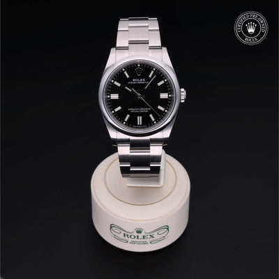 Rolex Certified Pre-owned Oyster Perpetual M126000-0002 front on black background