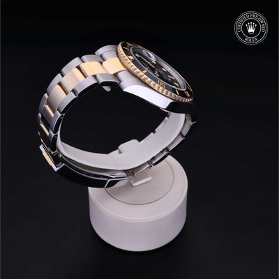Rolex Certified Pre-owned Submariner M116613LN-0001 front on black background