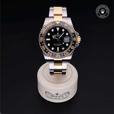 Rolex Certified Pre-owned GMT M116713LN-0001 front on black background