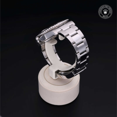 Rolex Certified Pre-owned GMT M116710LN-0001 front on black background