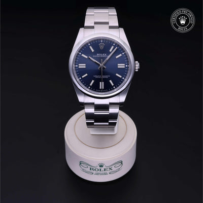 Rolex Certified Pre-owned Oyster Perpetual M124300-0003 front on black background