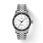 Silver Tissot watch with a white face on a light gray background
