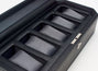 Black watch box with five padded compartments and silver clasp closure.