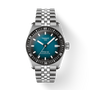 Silver Tissot watch with blue face on a white background