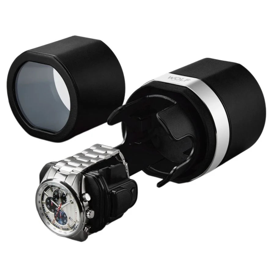 Black and white watch with chronograph dial and two detachable black cylindrical lens covers with white bands.