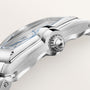 White and silver die-cast roadster model with detailed wheels, windshield, and sleek body design shown from side angle.