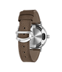 Silver-tone watch with round dial, taupe leather strap, and visible caseback showing water resistance rating.
