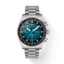 Tissot watch with silver bracelet and blue dial on a white background