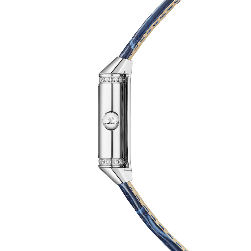 Reverso Classic Duetto watch with rectangular silver case, diamond bezels, and blue leather strap.