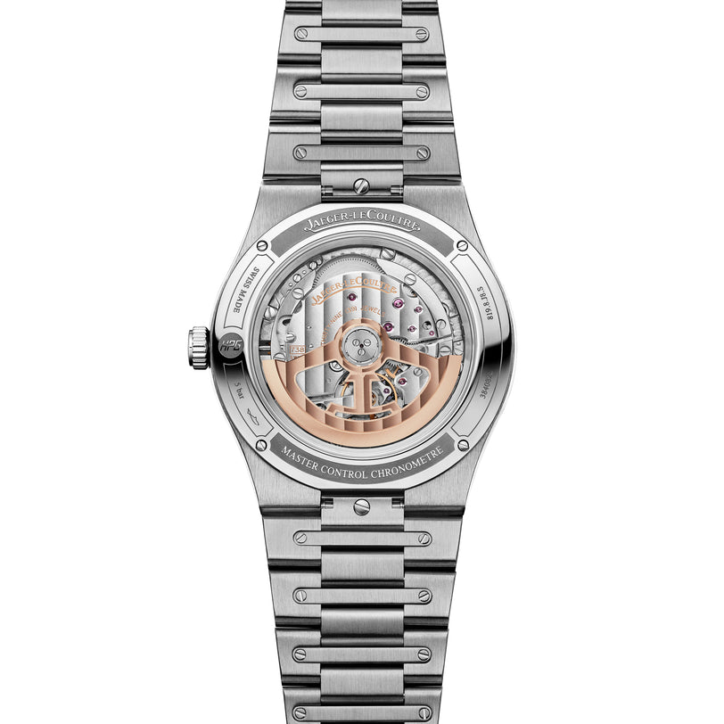 Silver stainless steel watch with visible skeleton movement, date window, and matching metal bracelet.