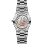 Silver stainless steel watch with visible skeleton movement, date window, and matching metal bracelet.