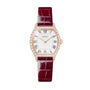 Rose gold tonneau watch with diamond-set bezel, cream dial with Roman numerals, and burgundy crocodile leather strap.
