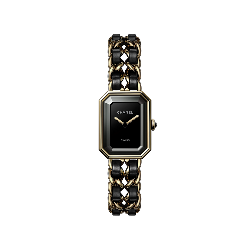 The Chanel Première Édition Originale Medium Model features a black-lacquered dial, yellow gold steel bezel, gold hands, and a chain-link bracelet interwoven with black leather.