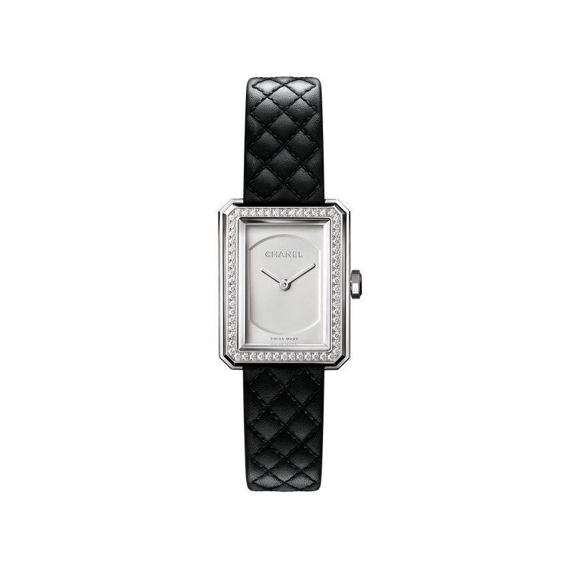The Chanel Boy·Friend Small Model wristwatch features a rectangular silver case, diamond bezel, minimalistic white dial, and a black quilted calfskin strap, displayed against a plain white background.