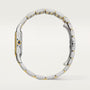 Silver and gold watch band on a light gray background