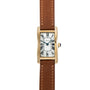 Cartier Tank Cintrée Ladies watch with a gold rectangular case, Roman numerals, and brown leather strap, shown from above.
