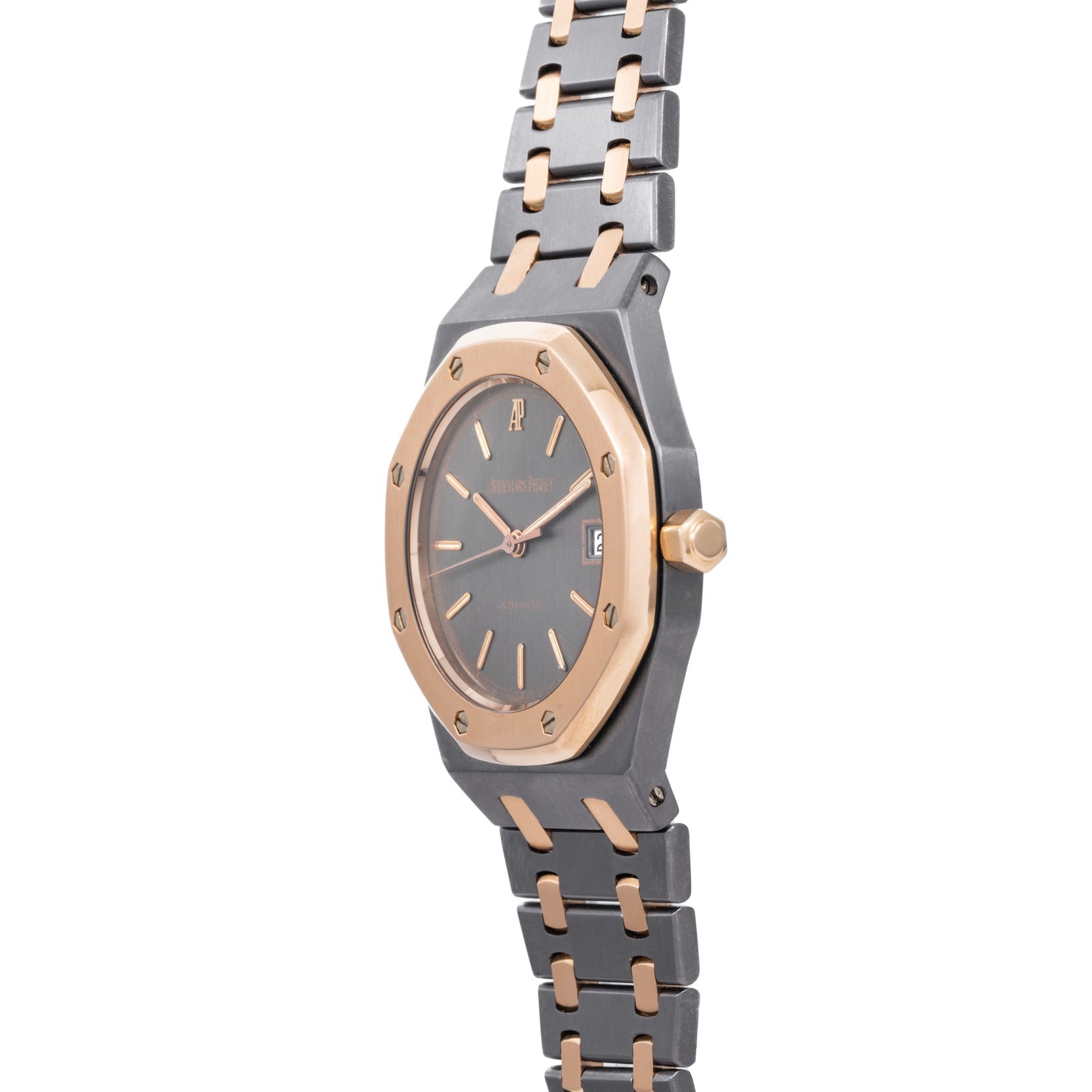 The Audemars Piguet Royal Oak Tantalum is a two-tone wristwatch featuring a gray and rose gold metal band with a dark date-display face.