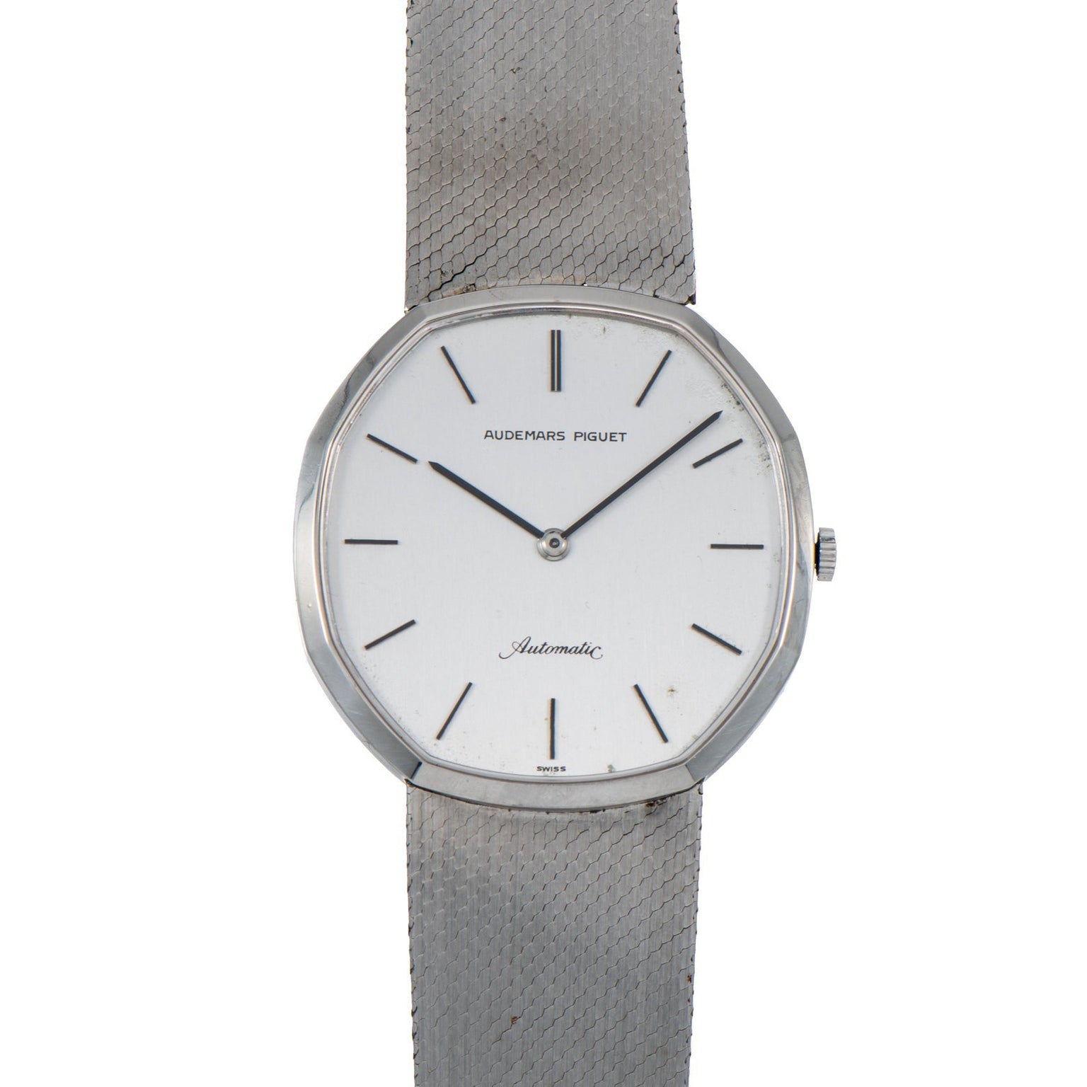 An Audemars Piguet Steel Dress Watch featuring a white dial, silver mesh band, and minimal hour markers.