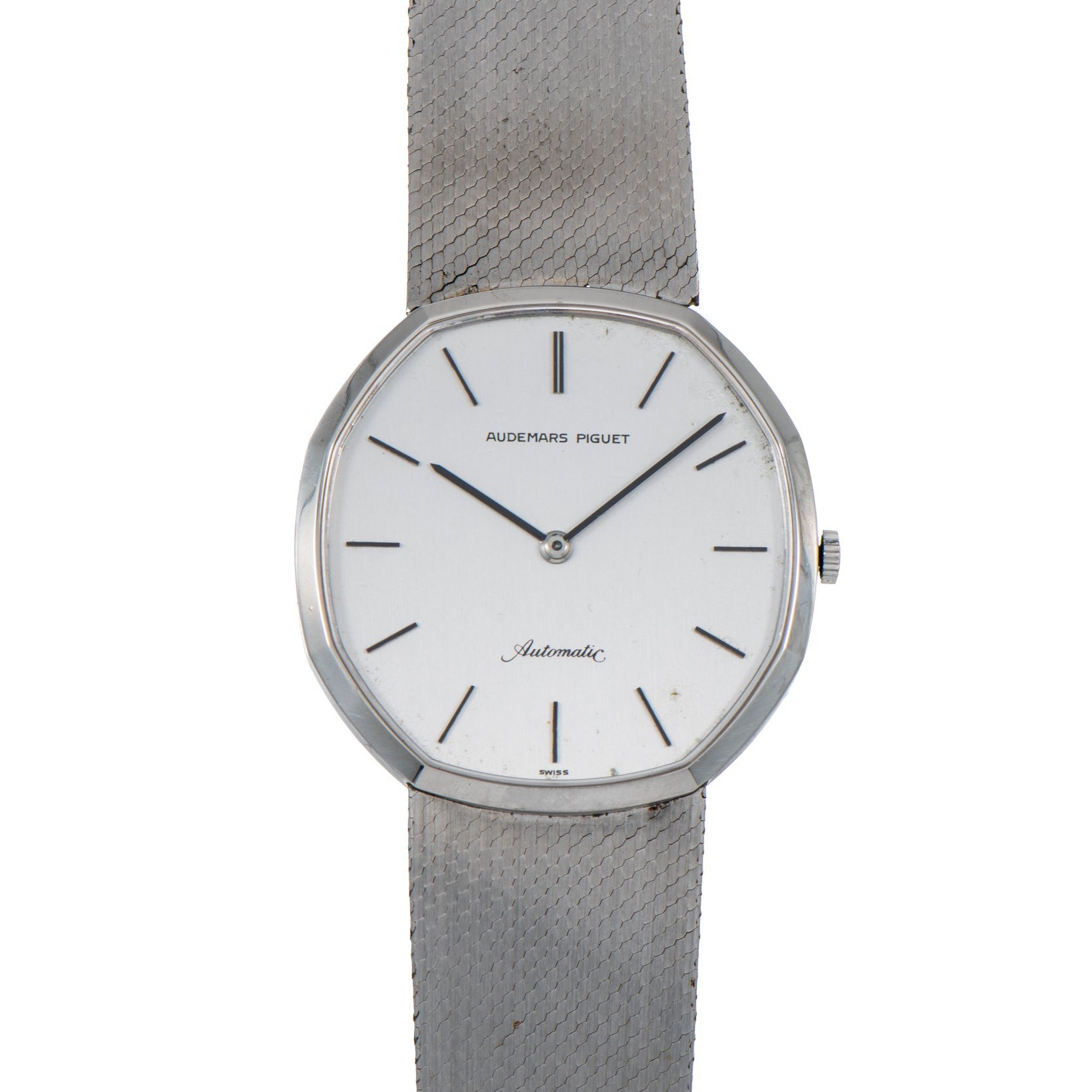 An Audemars Piguet Steel Dress Watch featuring a white dial, silver mesh band, and minimal hour markers.