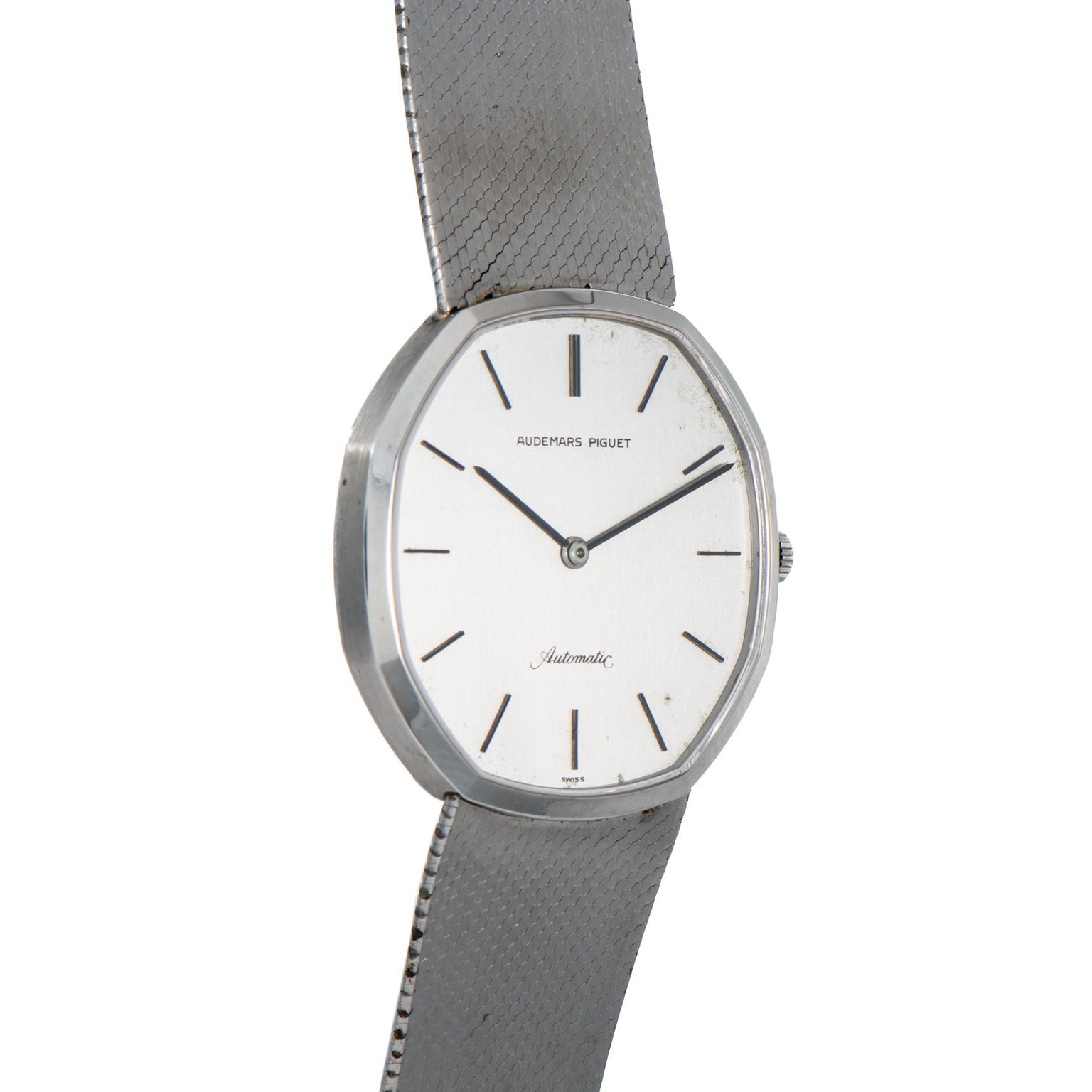 An Audemars Piguet Steel Dress Watch featuring a sleek white dial and slim black hour markers.