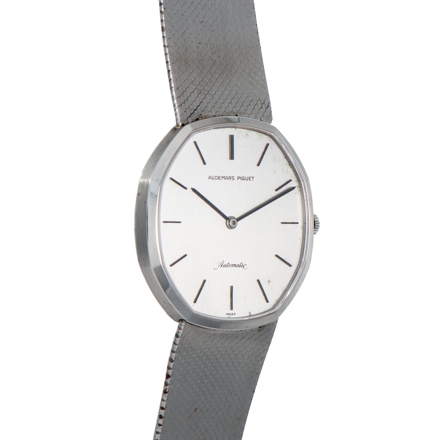 An Audemars Piguet Steel Dress Watch featuring a sleek white dial and slim black hour markers.