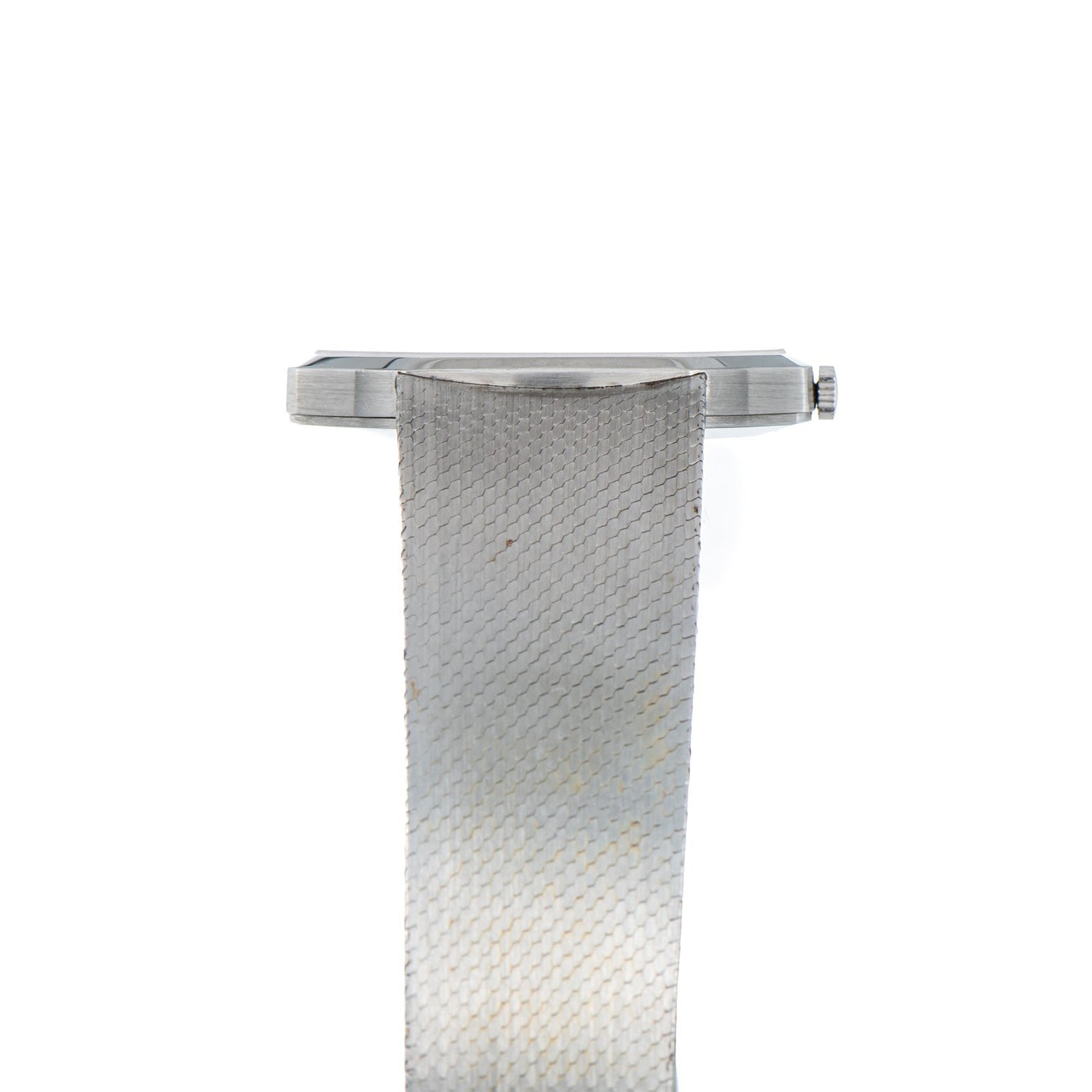 Side view of the Audemars Piguet Steel Dress Watch featuring a silver mesh metal band, displayed on a white background.