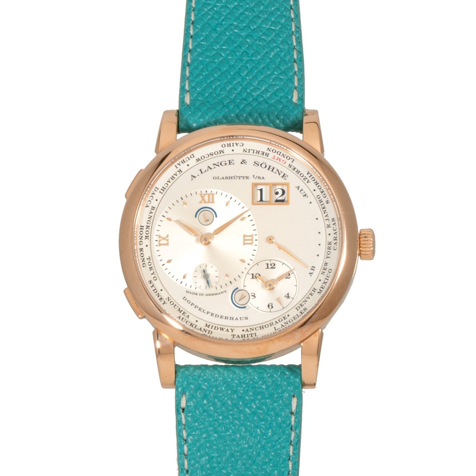 The Lange & Sohne Lange 1 Timezone features a white dial with Roman numerals and a turquoise leather strap.