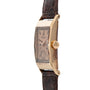 Side view of the Patek Philippe Tegolino Dress Watch, featuring a rectangular gold case, visible crown, and brown leather strap.