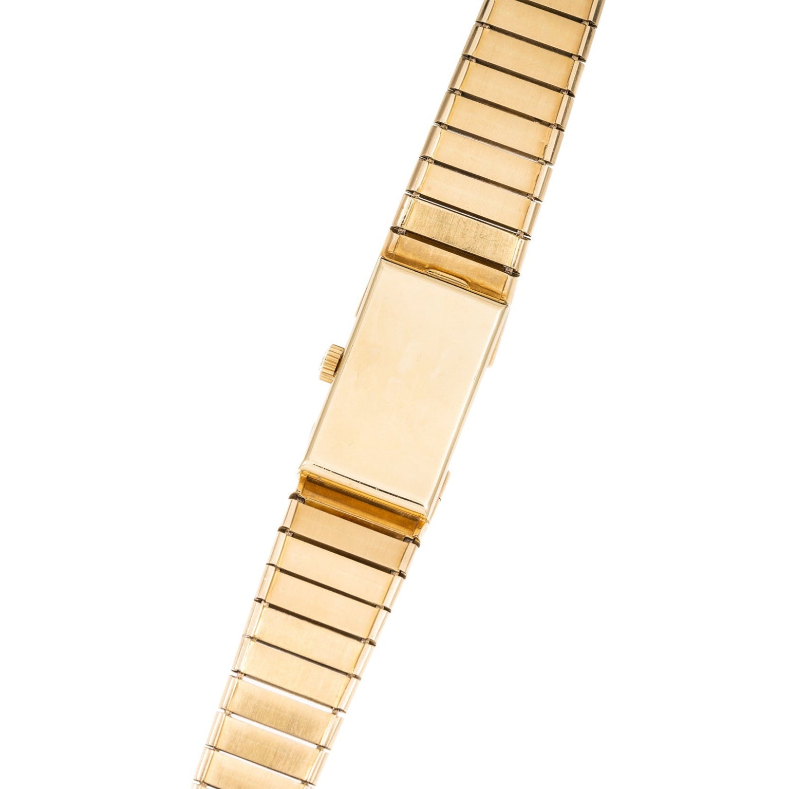 Patek Philippe Yellow Gold Integrated Dress Watch featuring a rectangular blank face and gold link band, viewed from above.