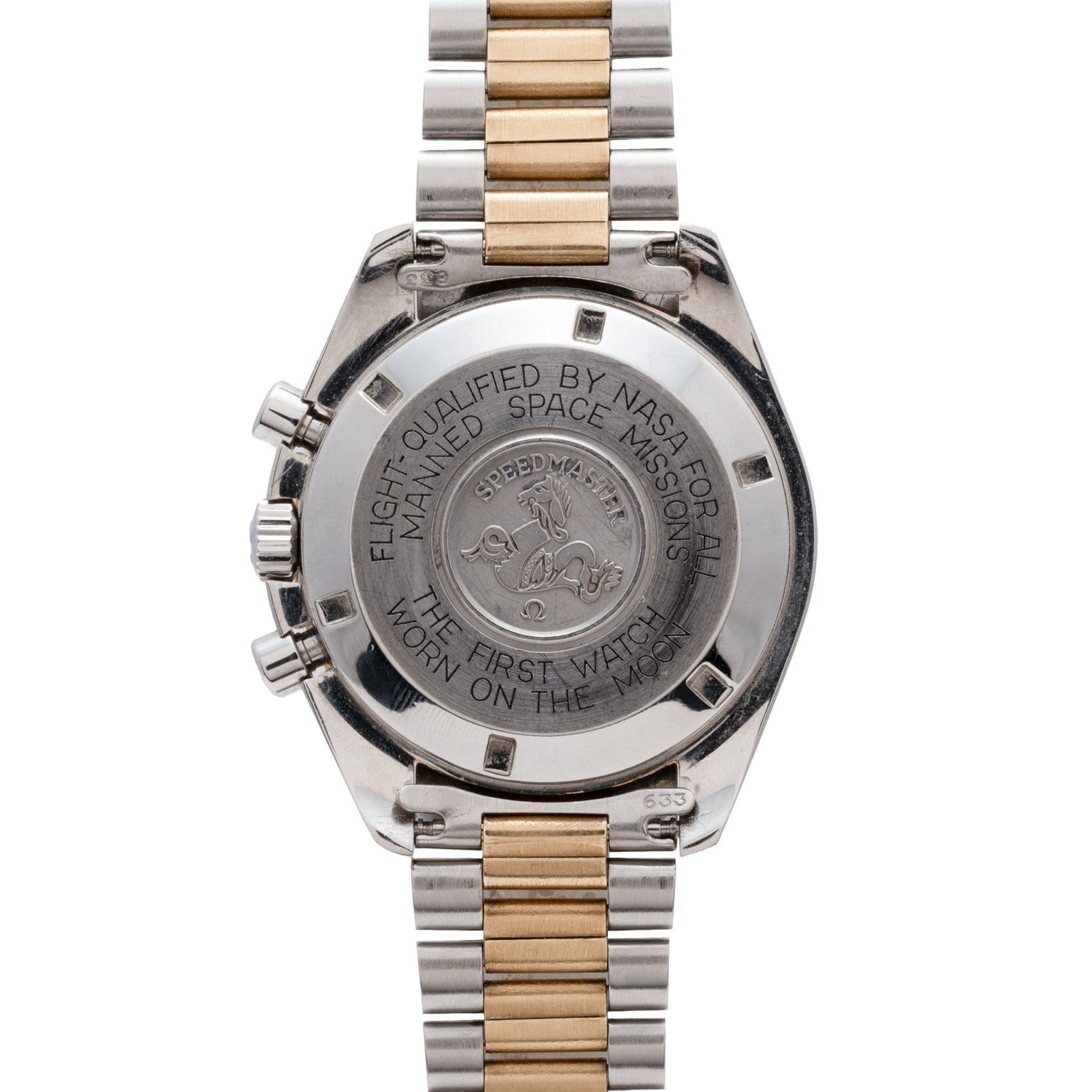 Back of the OMEGA Speedmaster Professional Two-Tone watch, engraved with NASA space mission and moon landing details.