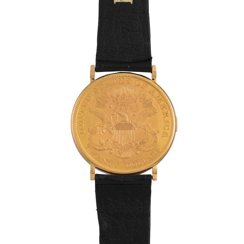 The Piaget 1877 Twenty Dollar Coin Watch features a black leather strap and showcases the Great Seal of the United States on its face.