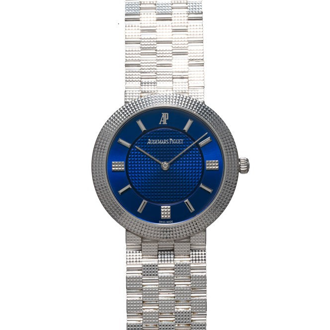 Audemars Piguet Classic White Gold Ultra-Thin wristwatch featuring a sleek metal link band and elegant design.