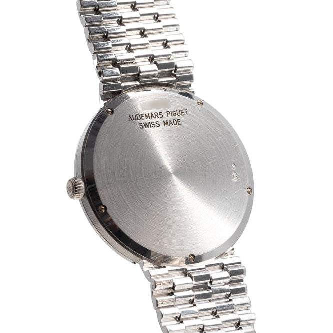 Back view of a Classic White Gold Ultra-Thin Audemars Piguet wristwatch with a metal link band.