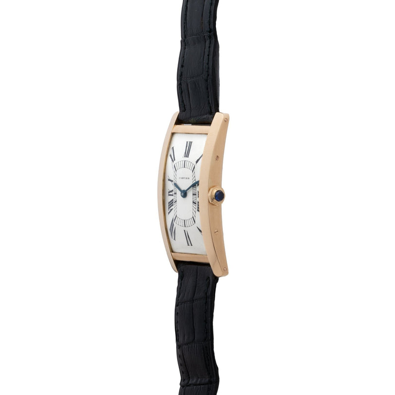 Side view of the Cartier Tank Cintrée Jumbo gold wristwatch featuring a white face, black Roman numerals, and a black leather strap.