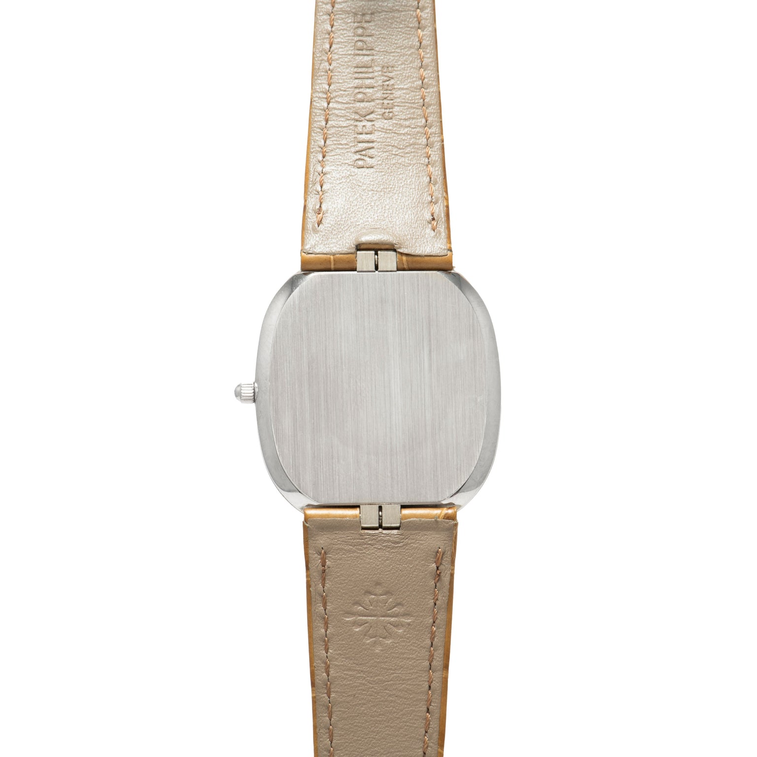 The Ellipse by Patek Philippe features a silver square watch case and a beige leather strap, displayed from the back.