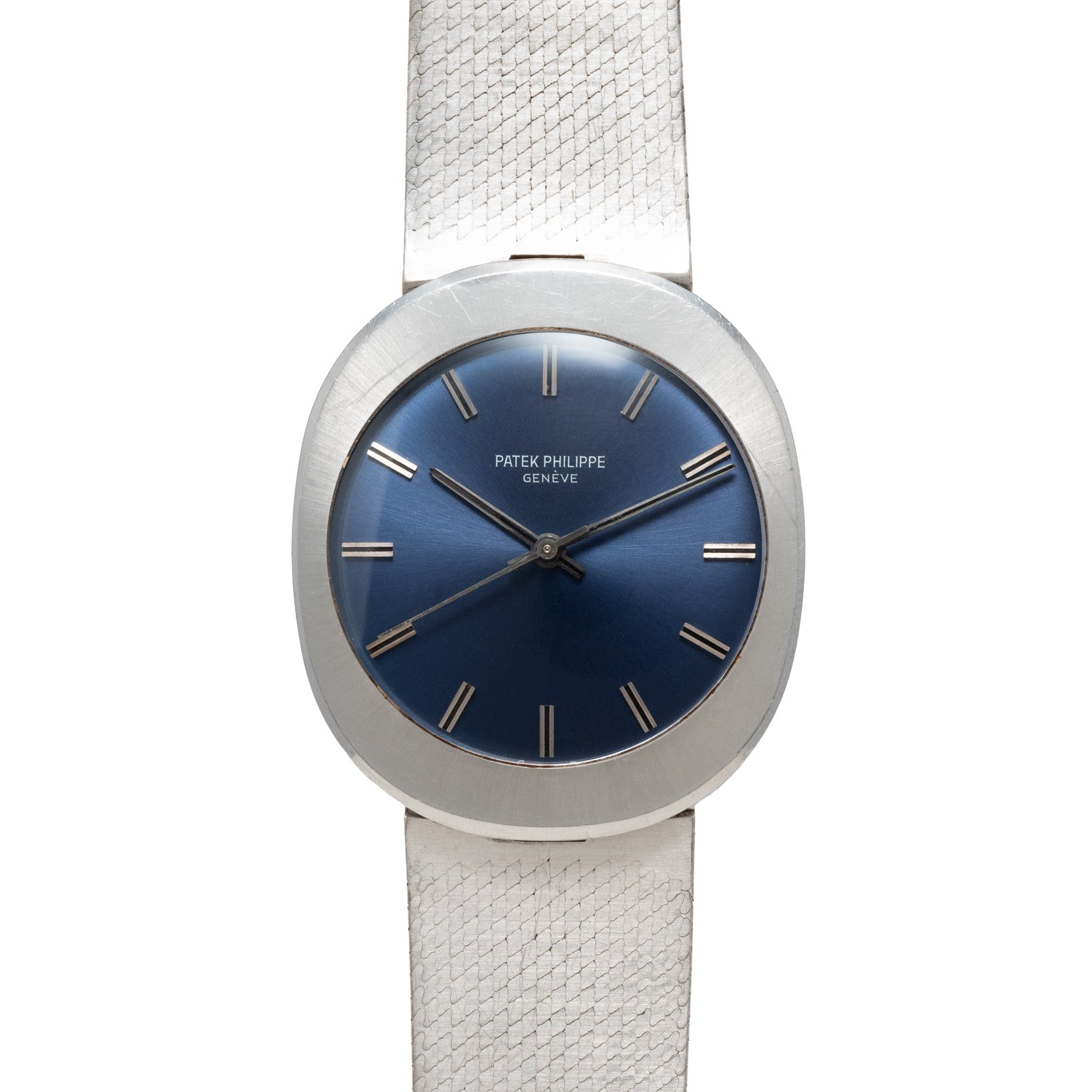 A Patek Philippe Dress Watch UFO featuring a silver case, blue dial, and silver hour markers on a textured silver band.