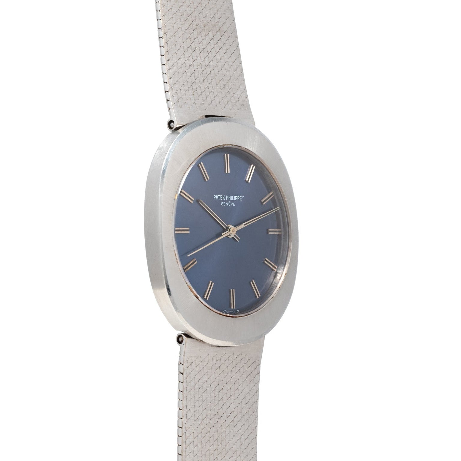 The Patek Philippe Dress Watch UFO features a blue face, silver case, and textured metal band, displayed at an angle.