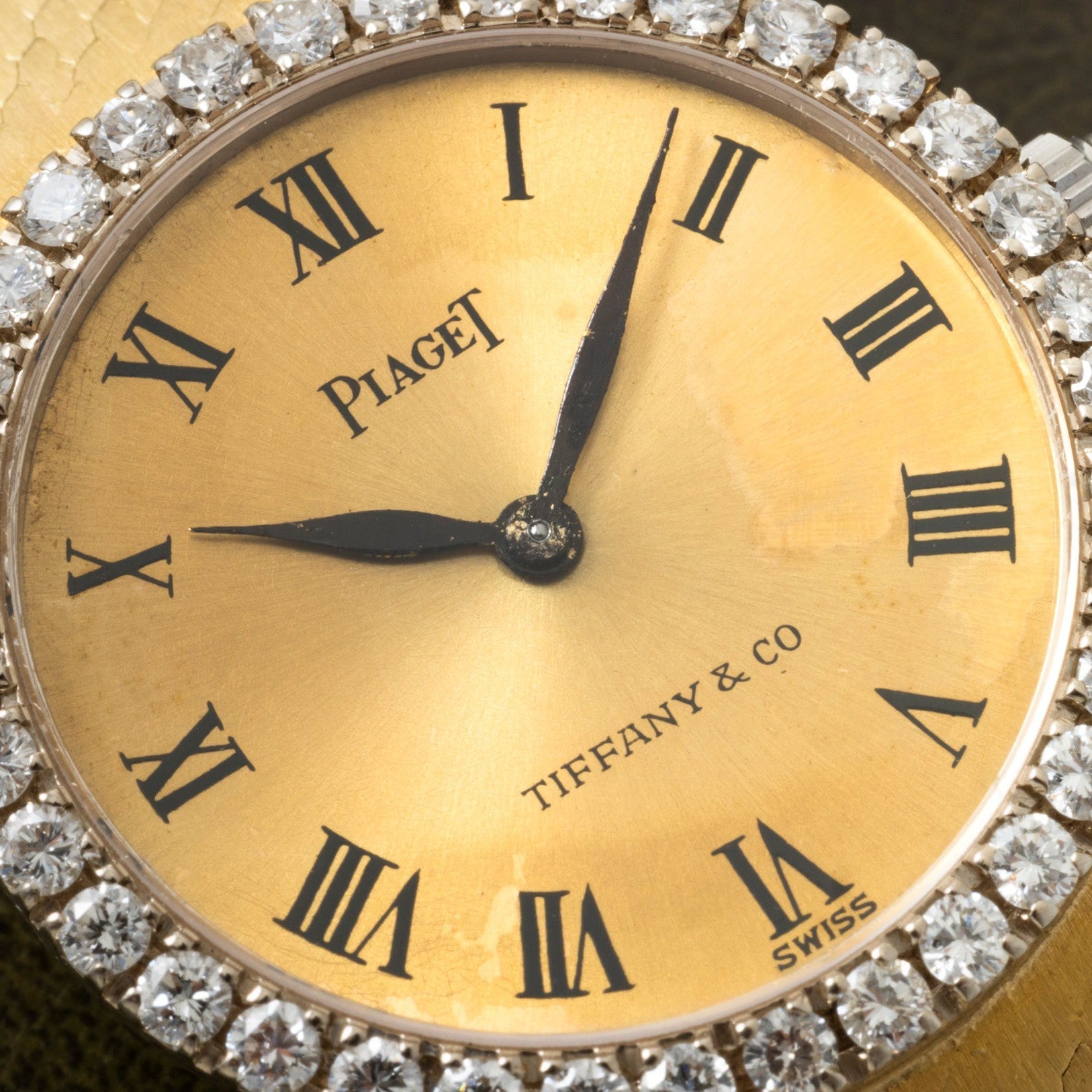 Close-up of a Piaget Ladies Diamond Watch for Tiffany & Co., featuring Roman numerals and a diamond bezel.