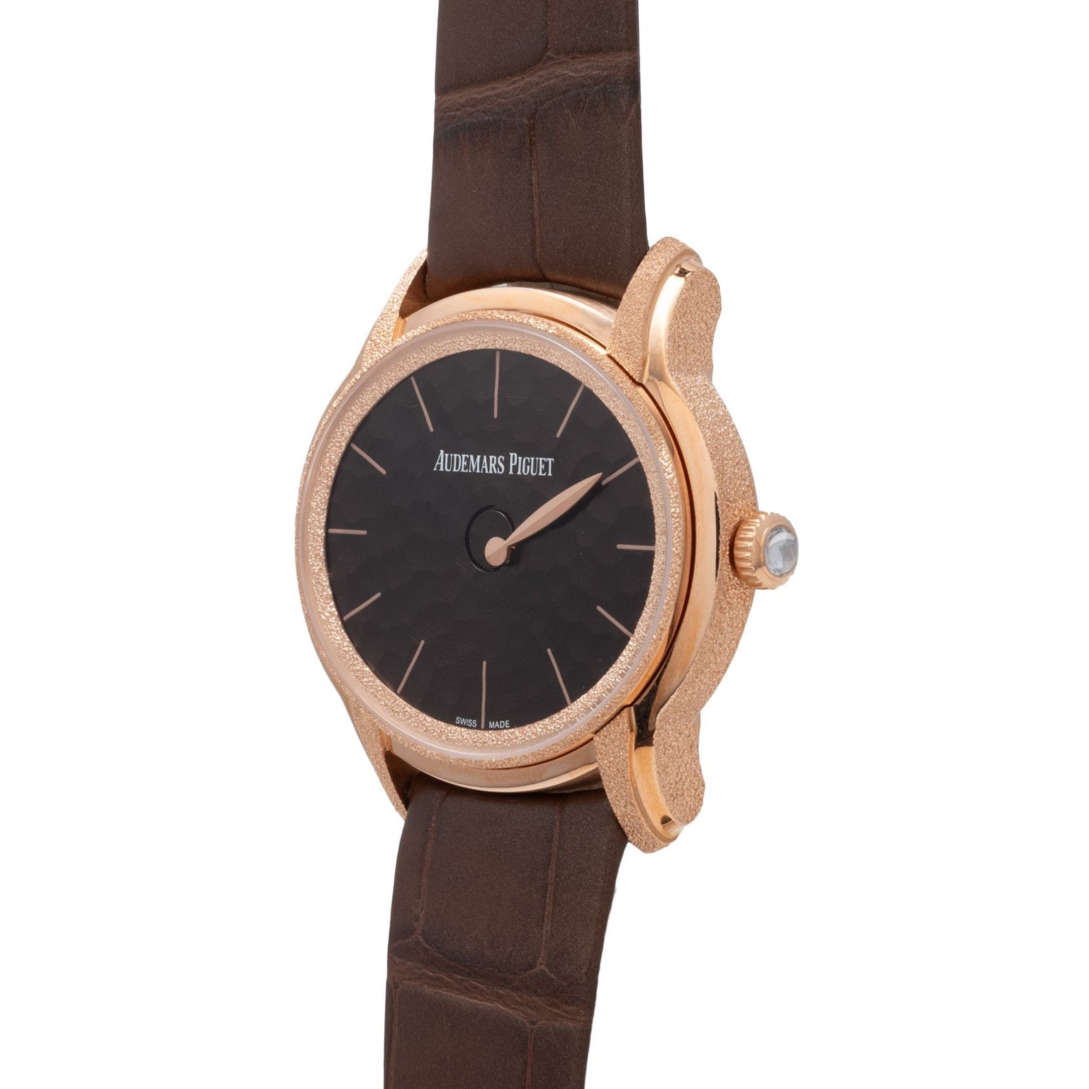 The Audemars Piguet Millenary Philosophique features a rose gold case, black dial, and brown leather strap.