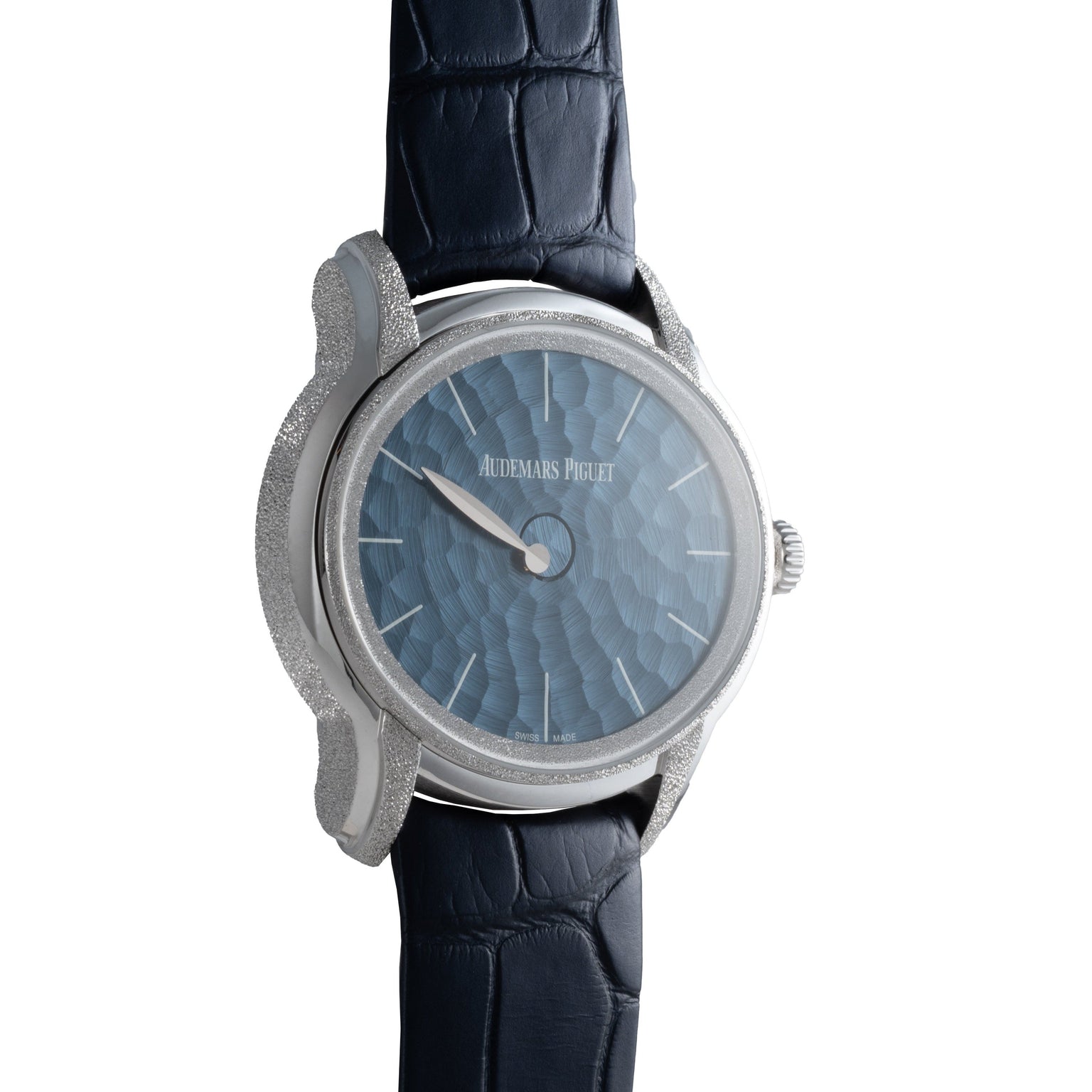 The Audemars Piguet Millenary Philosophique is a luxury watch featuring a textured blue dial and a dark blue leather strap.