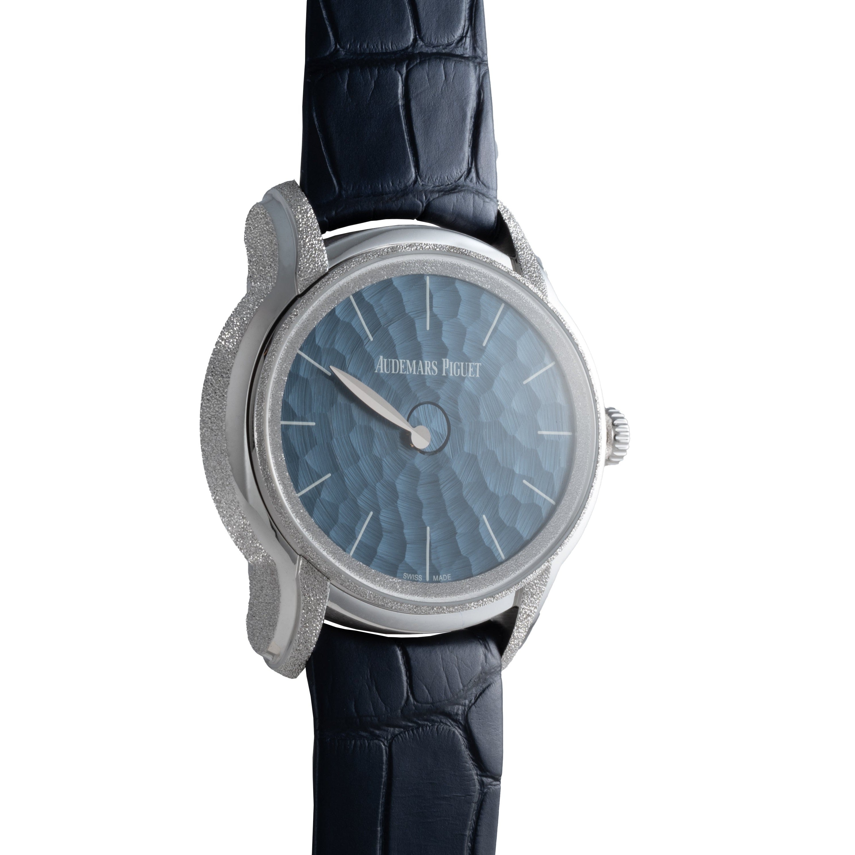 The Audemars Piguet Millenary Philosophique is a luxury watch featuring a textured blue dial and a dark blue leather strap.