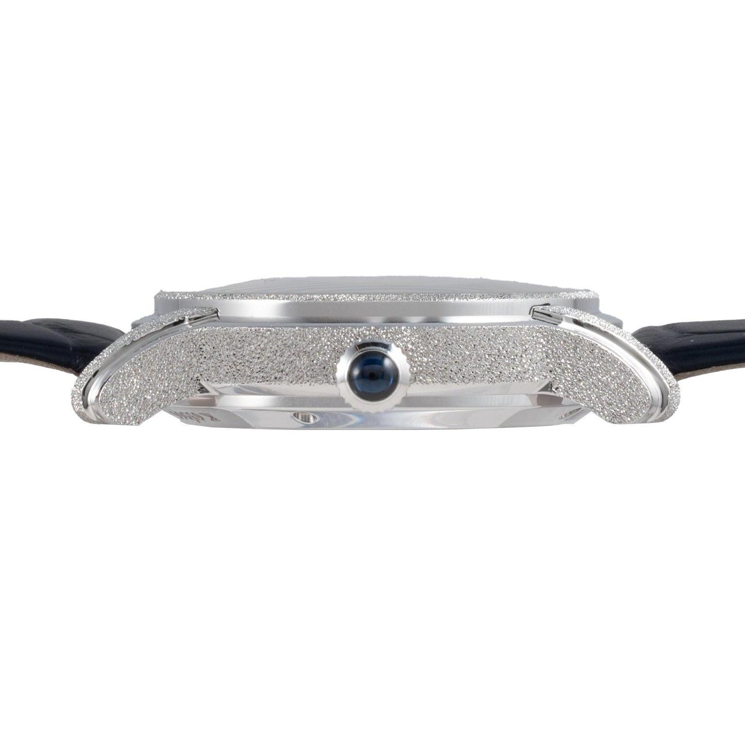 Side view of the Audemars Piguet Millenary Philosophique, a slim silver wristwatch with a textured case and black leather strap.