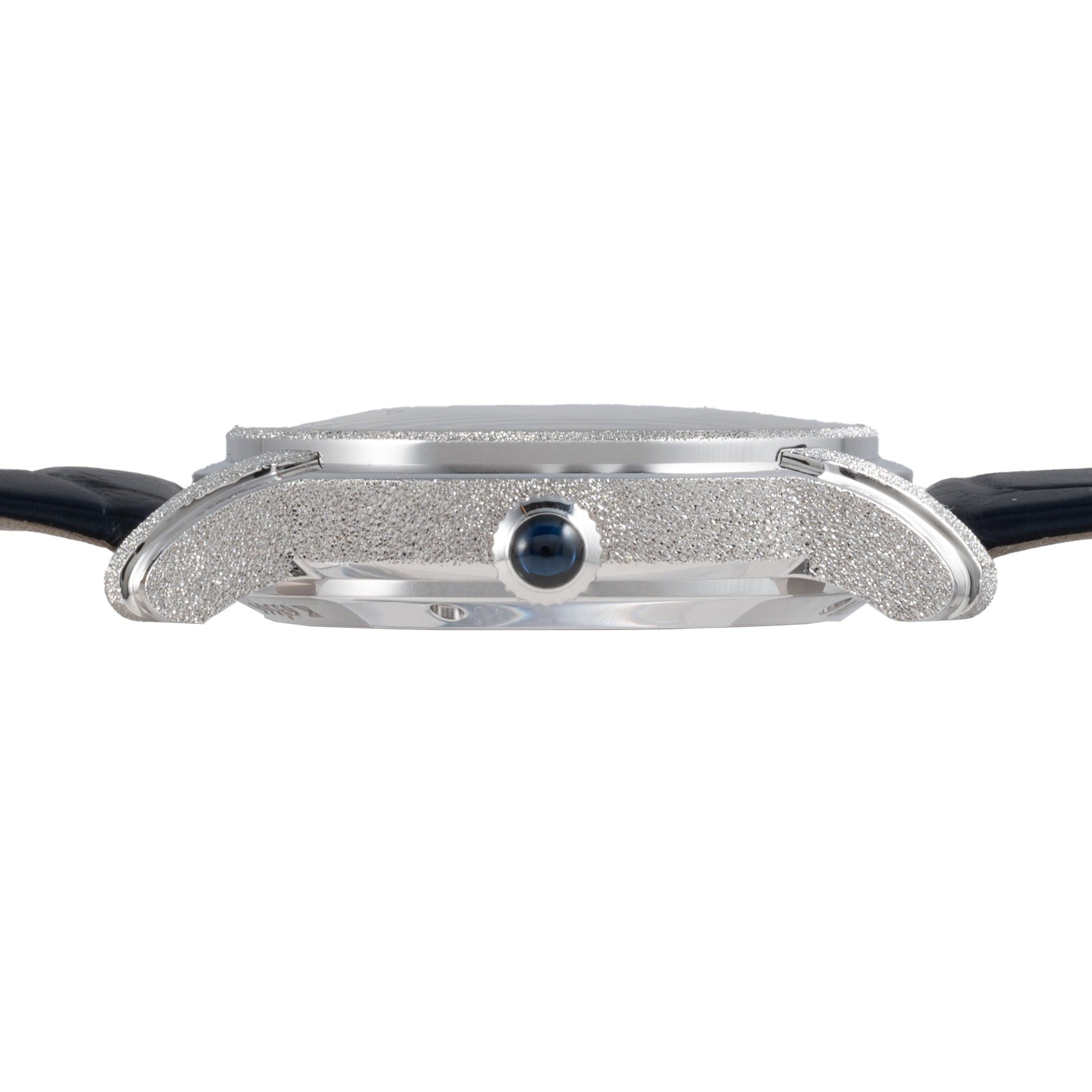 Side view of the Audemars Piguet Millenary Philosophique, a slim silver wristwatch with a textured case and black leather strap.