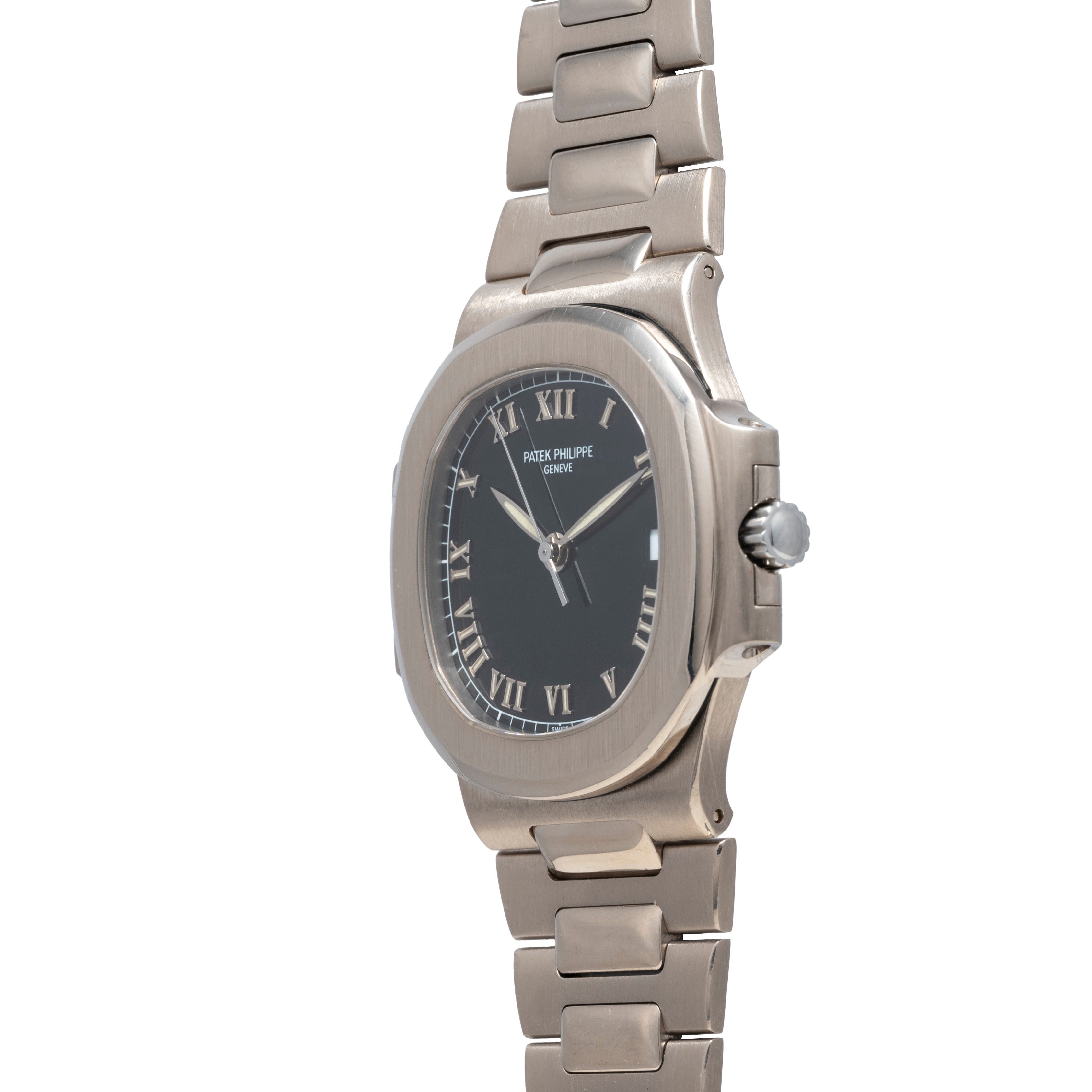 The Patek Philippe Nautilus wristwatch features a silver case, black dial, and Roman numerals, displayed at an angle on a white background.