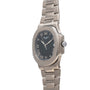 The Patek Philippe Nautilus wristwatch features a silver case, black dial, and Roman numerals, displayed at an angle on a white background.