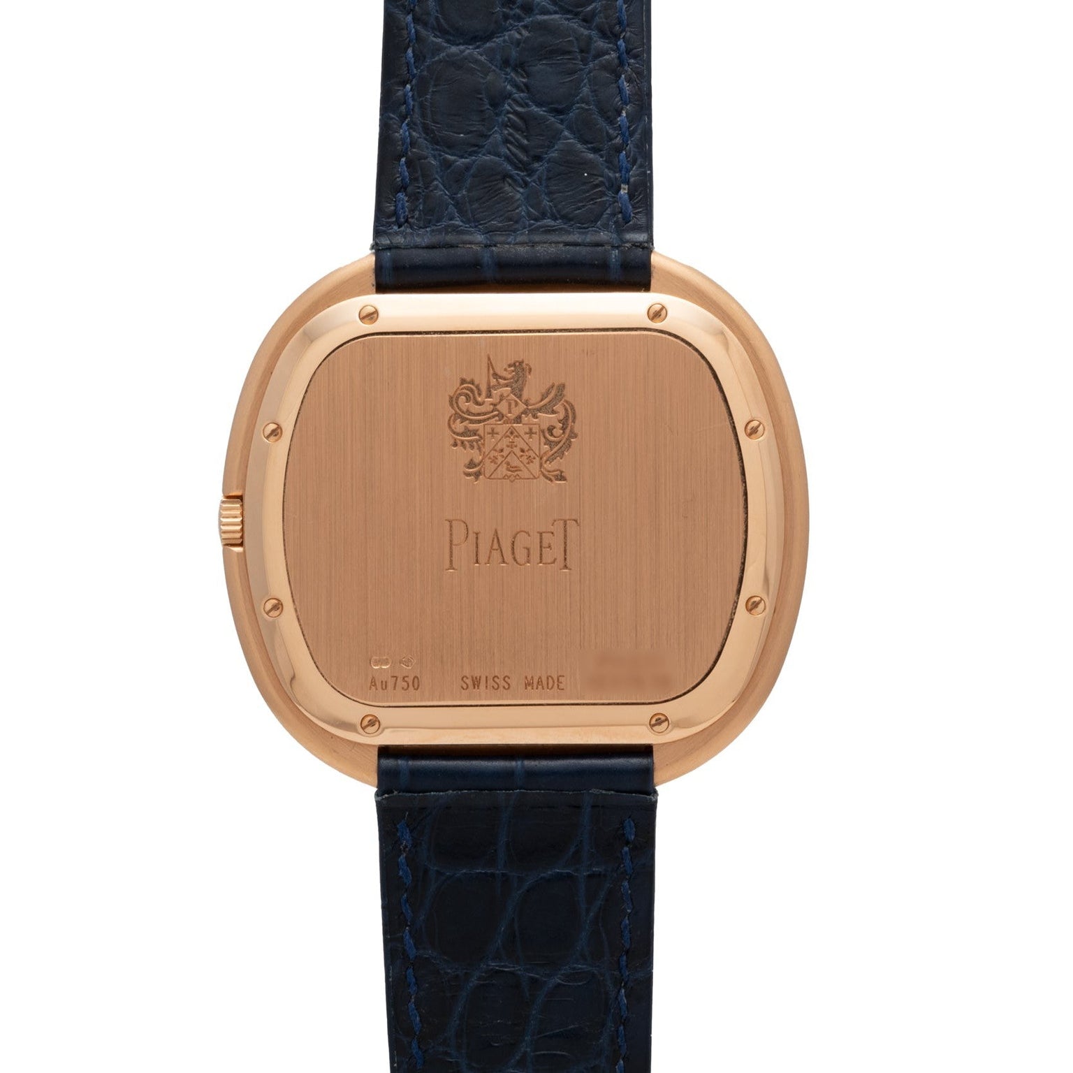 The back of a Piaget Black Tie Andy Warhol watch with a black textured leather strap and engraved markings.