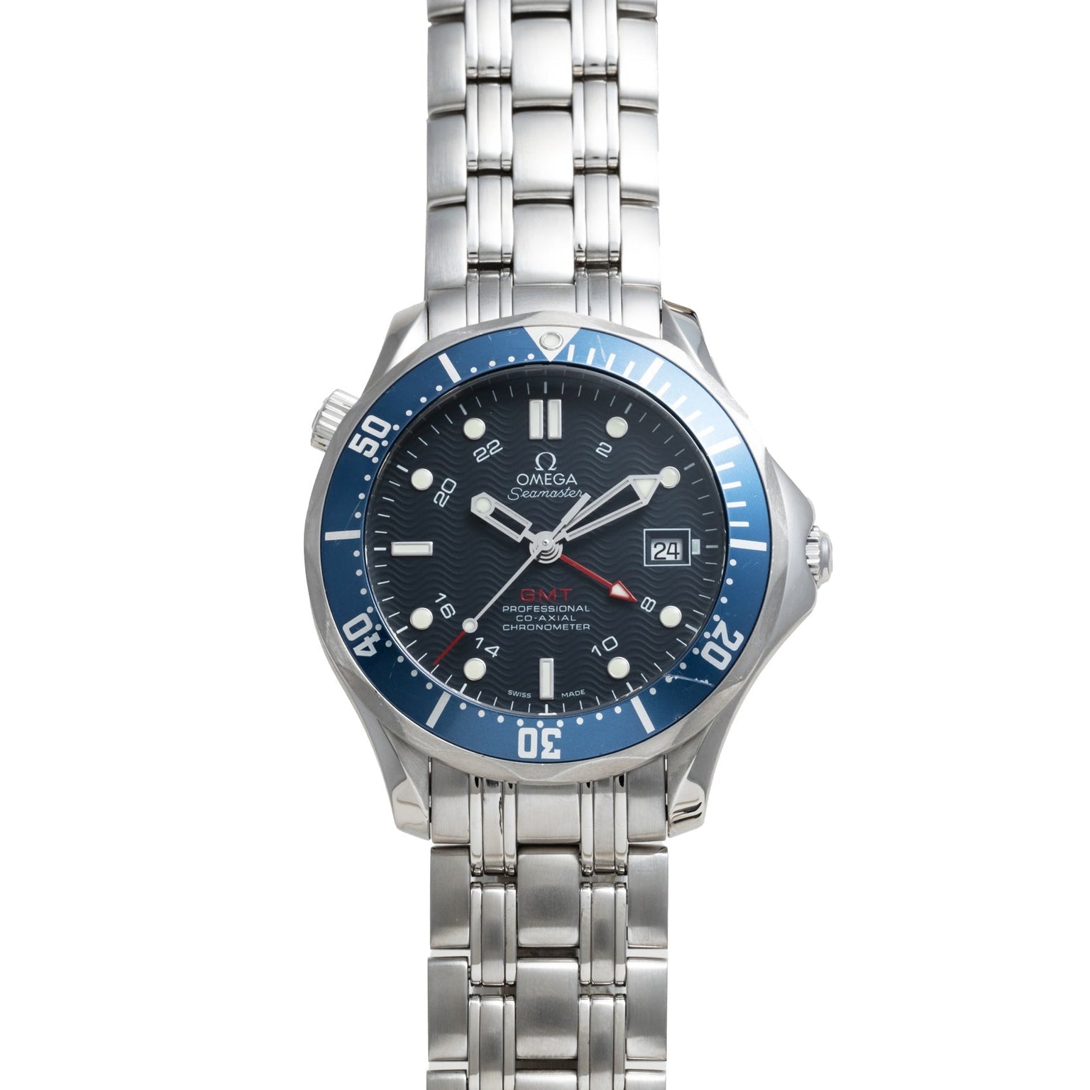 The OMEGA Seamaster 300 Professional GMT wristwatch features a blue bezel, black dial, metal link band, and displays the date at 3 o’clock.