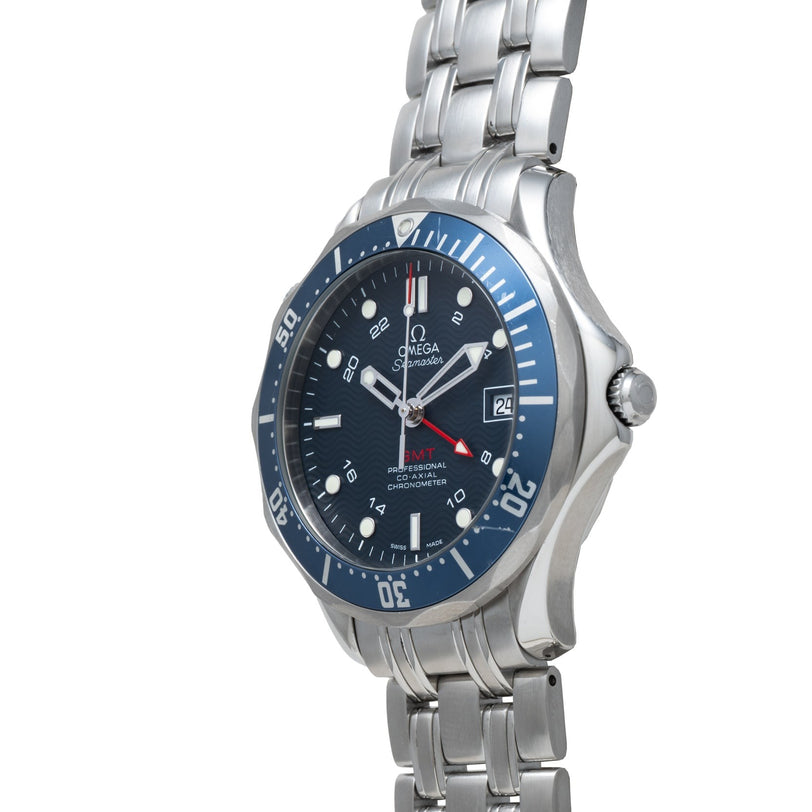 OMEGA Seamaster 300 Professional GMT watch in silver with blue bezel, metal band, and date display, displayed at an angle.