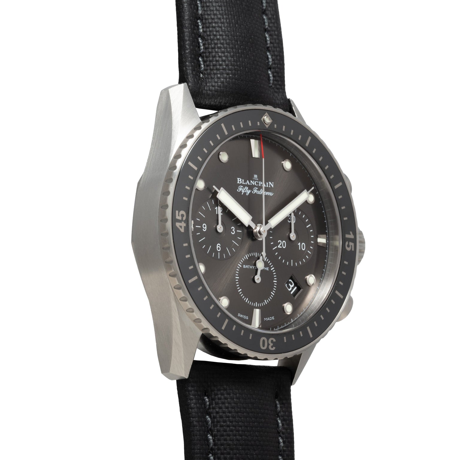 The Blancpain Fifty Fathoms Bathyscaphe Chronographe Flyback is a luxury dive watch featuring a black dial, chronograph functions, and a black fabric strap.