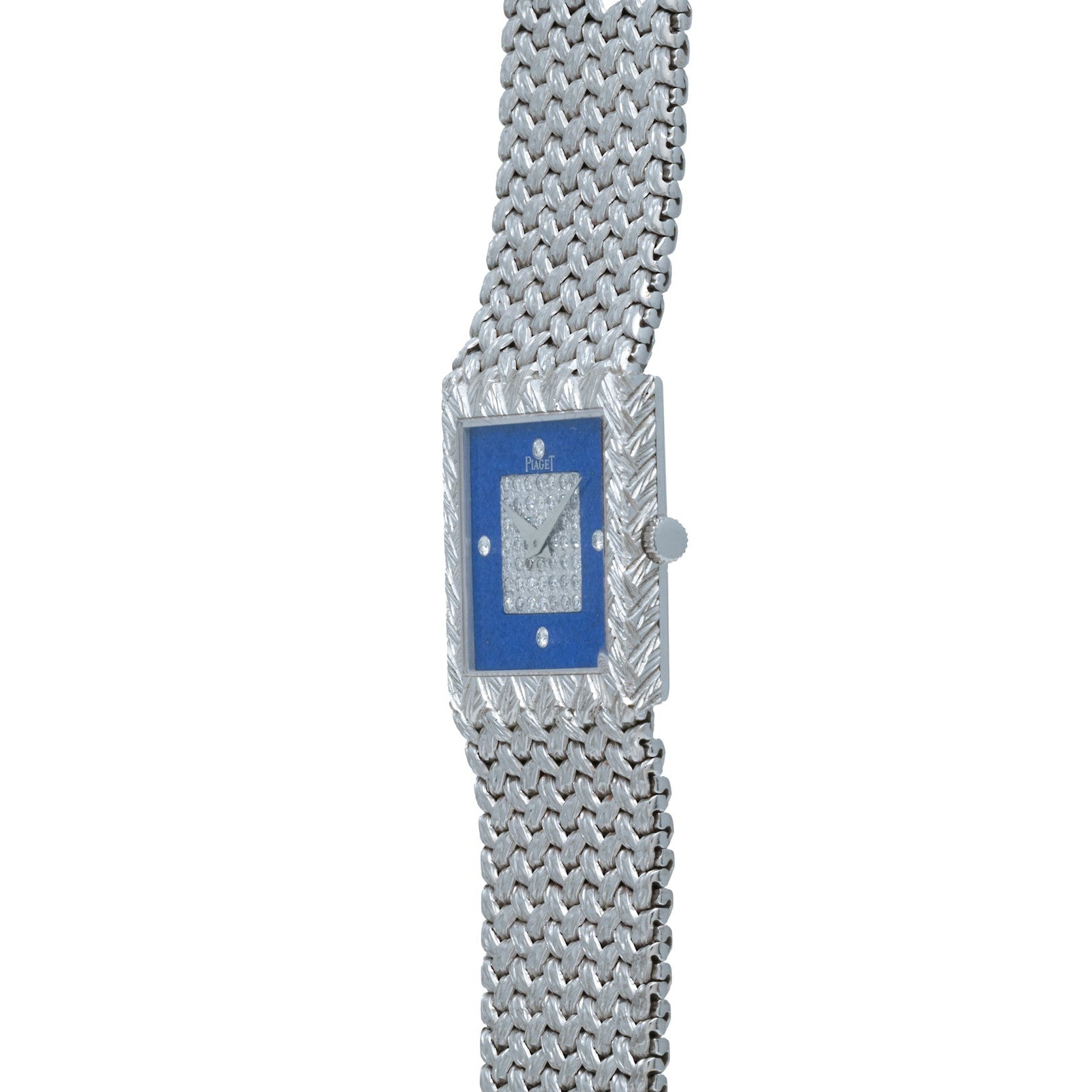 The Piaget Tradition Lapis Lazuli Diamond Dress Watch is a luxury silver wristwatch featuring a blue rectangular face and a textured metal band.